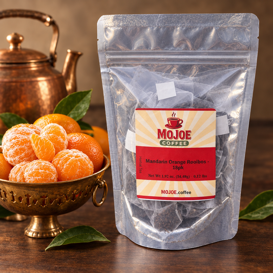 Mandarin Orange Rooibos tea beside mandarins in a copper bowl and a copper kettle