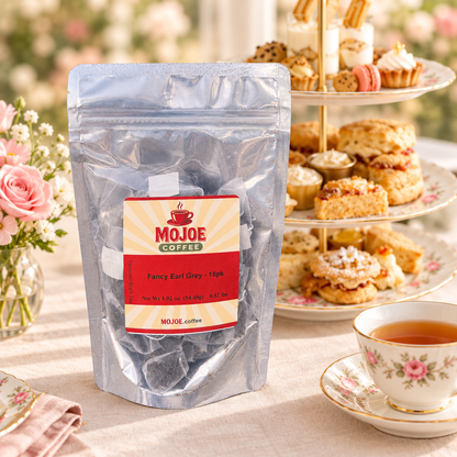 Fancy Earl Grey tea pouch beside a teacup and tiered afternoon tea stand